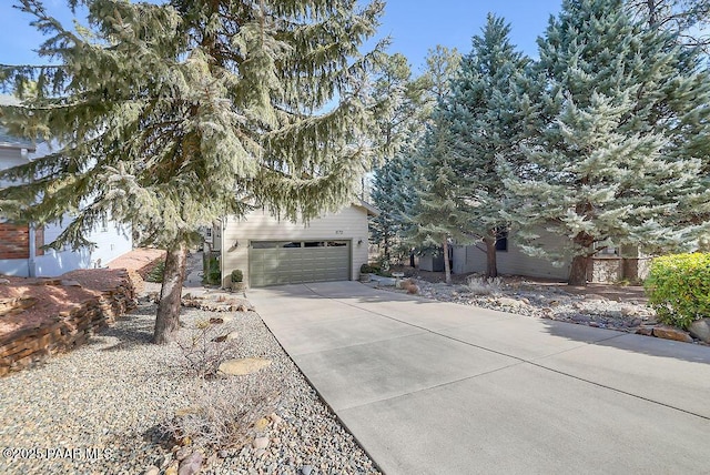 obstructed view of property featuring a garage