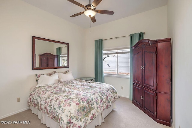 bedroom featuring light colored carpet and ceiling fan