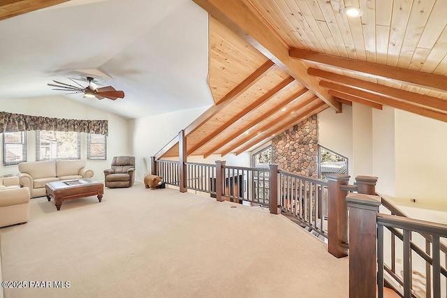 additional living space with carpet floors, vaulted ceiling with beams, wooden ceiling, and ceiling fan