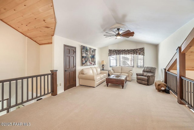 living room with lofted ceiling, carpet floors, and ceiling fan