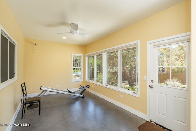 workout area with baseboards, healthy amount of natural light, a ceiling fan, and recessed lighting