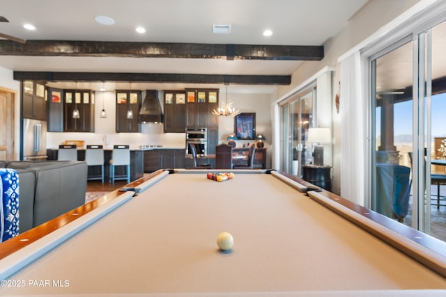 playroom with beam ceiling and a notable chandelier