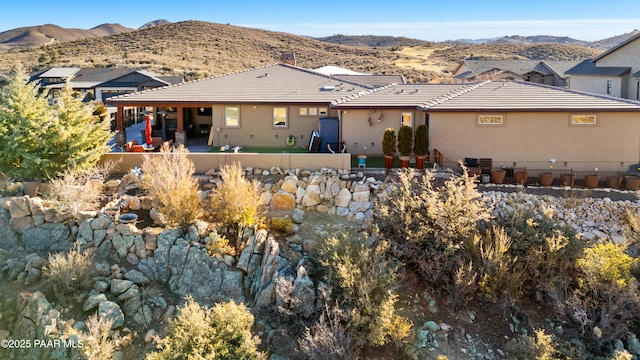 rear view of property featuring a mountain view