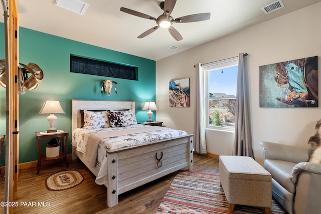 bedroom with dark wood-type flooring and ceiling fan