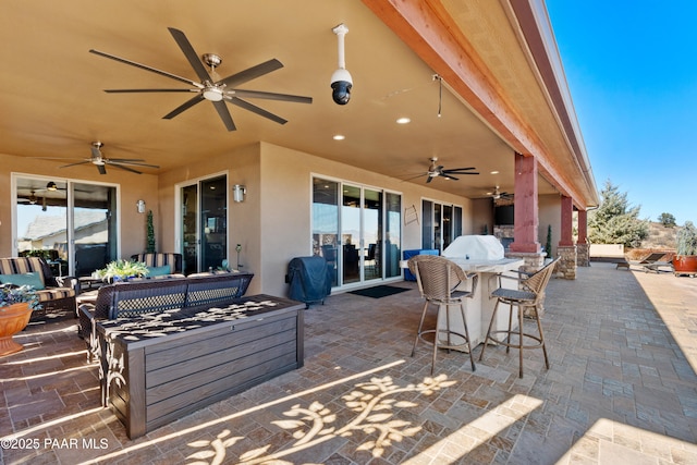 view of patio / terrace featuring an outdoor hangout area and ceiling fan