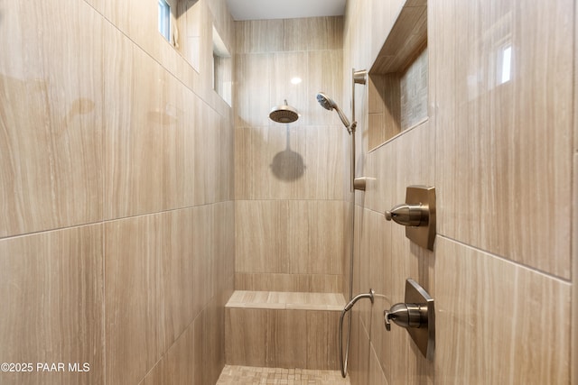 bathroom featuring tiled shower