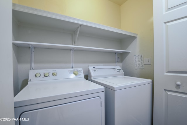 laundry room with washing machine and dryer and laundry area