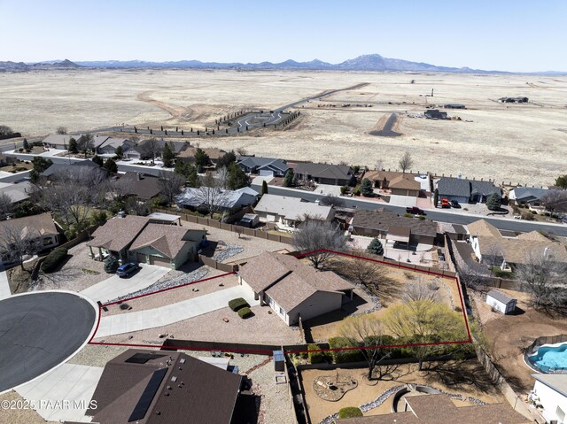 drone / aerial view featuring a mountain view and a residential view