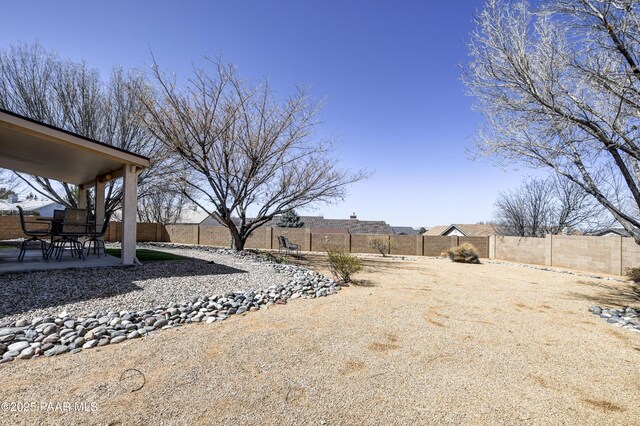 view of yard featuring a fenced backyard and a patio