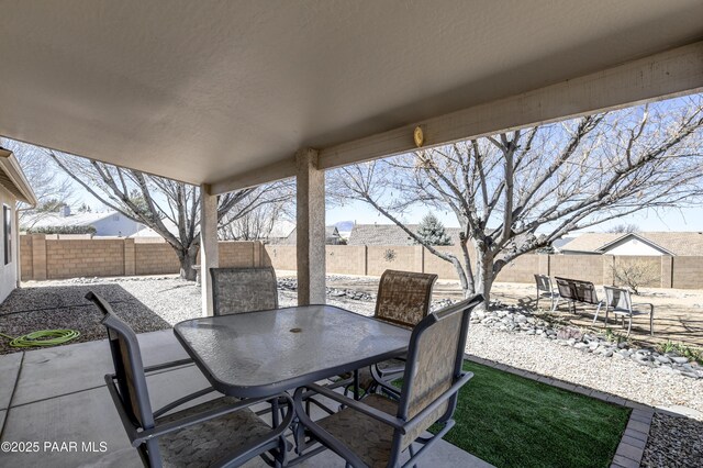 view of patio featuring a fenced backyard and outdoor dining space