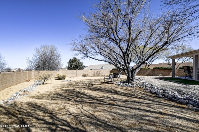 view of yard featuring a patio area and a fenced backyard