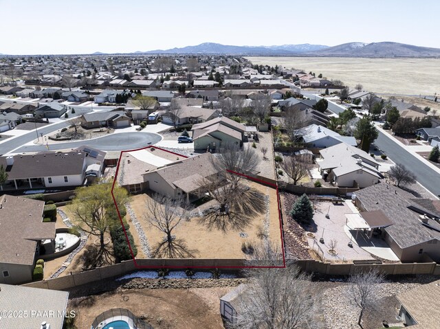 drone / aerial view with a residential view and a mountain view