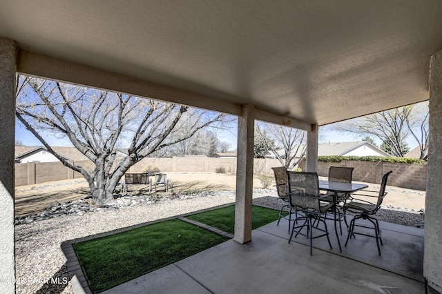 view of patio / terrace with a fenced backyard and outdoor dining space