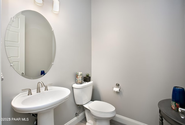 12345 N Petra Cir, Prescott, AZ 86305 - bathroom with baseboards, toilet, and a sink
