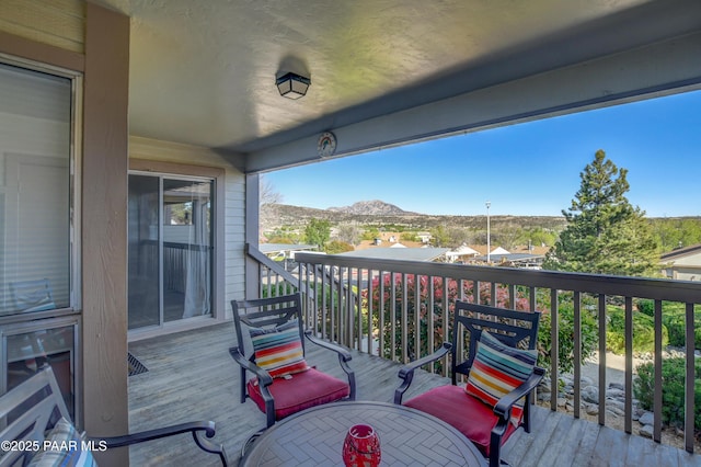 wooden terrace with a mountain view