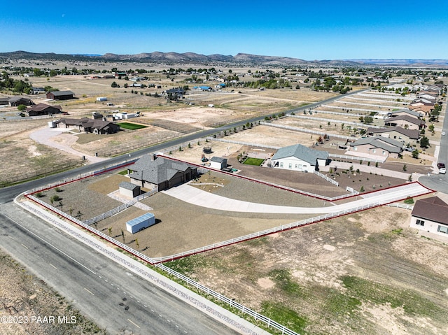 birds eye view of property featuring a mountain view