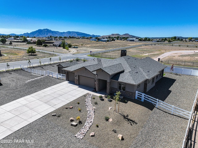 drone / aerial view featuring a mountain view