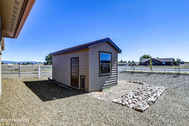 view of outbuilding with a mountain view