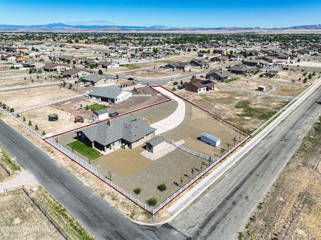 birds eye view of property featuring a mountain view