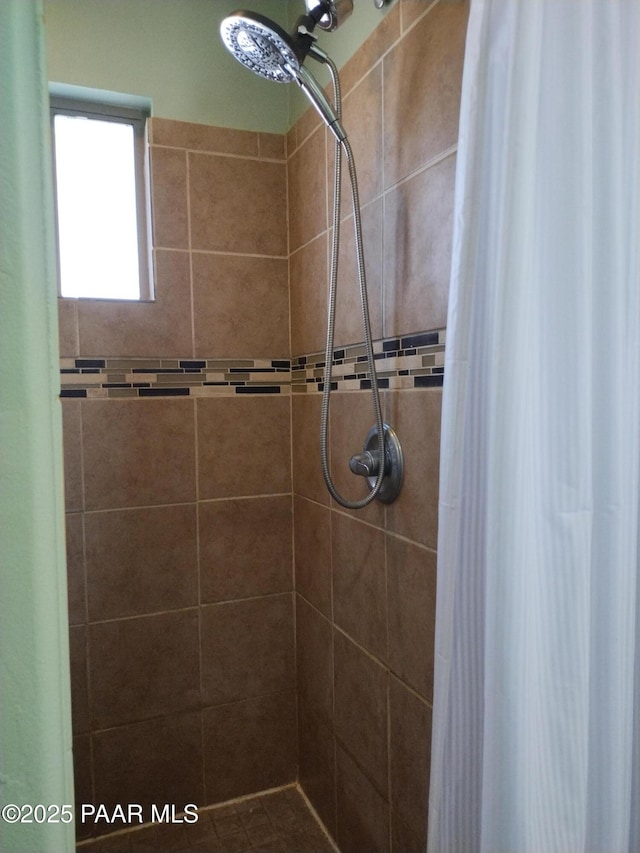 bathroom featuring a shower with curtain