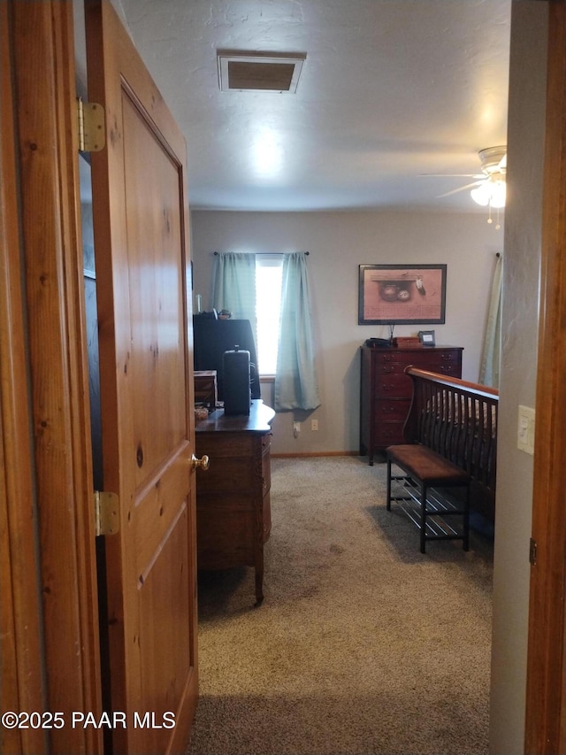 bedroom featuring light carpet