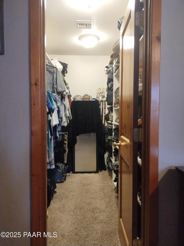 bedroom featuring ceiling fan and carpet flooring