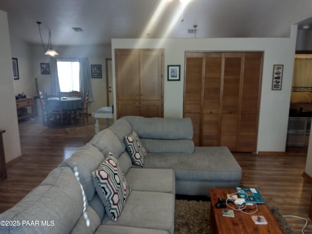 living room with dark wood-type flooring