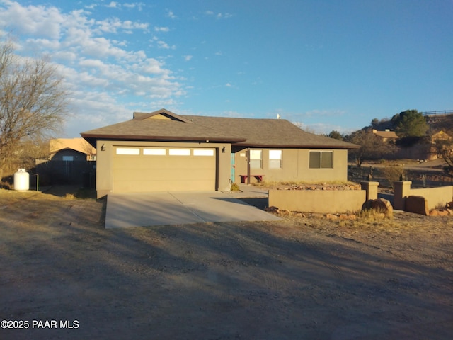 view of front of home with a garage