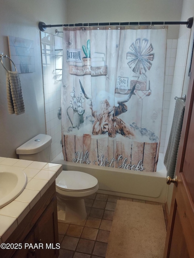 full bathroom with shower / tub combo with curtain, vanity, tile patterned flooring, and toilet