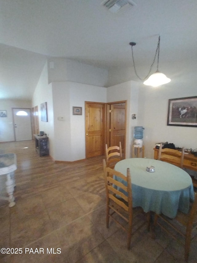 dining room with lofted ceiling