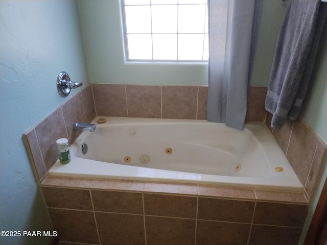 bathroom featuring tiled tub