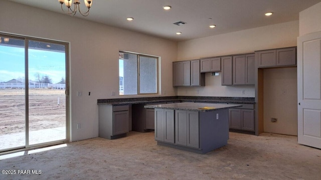 2485 Dillon Blvd, Chino Valley, AZ 86323 - kitchen with a kitchen island, recessed lighting, gray cabinetry, and visible vents