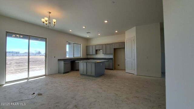 2485 Dillon Blvd, Chino Valley, AZ 86323 - kitchen with gray cabinets, a center island, dark countertops, an inviting chandelier, and recessed lighting
