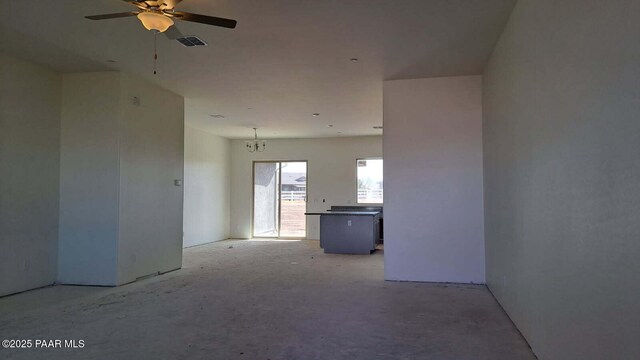 2485 Dillon Blvd, Chino Valley, AZ 86323 - empty room featuring ceiling fan with notable chandelier and visible vents