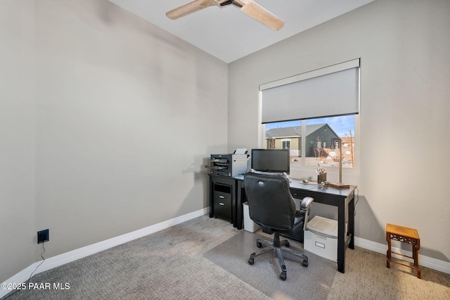 home office featuring light carpet and ceiling fan