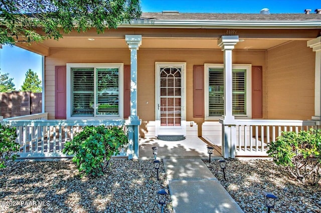 doorway to property with covered porch