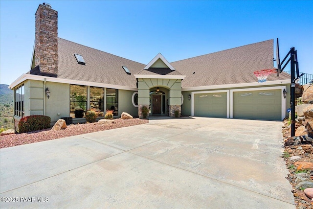 62 N French Dr, Prescott, AZ 86303 - view of front of home featuring a chimney, stucco siding, a garage, concrete driveway, and roof with shingles
