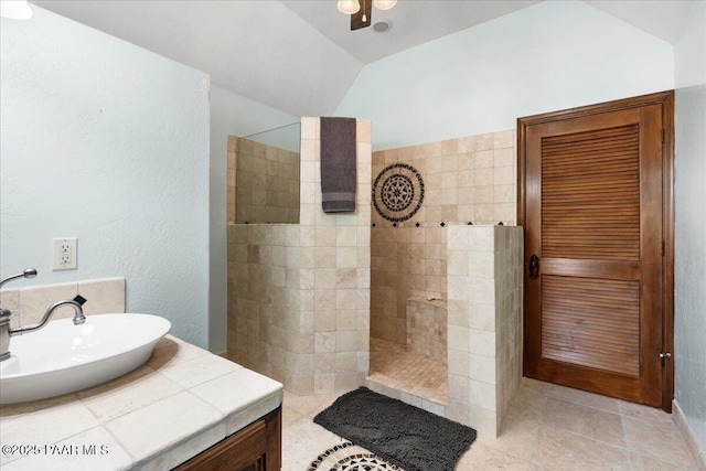 62 N French Dr, Prescott, AZ 86303 - bathroom featuring a sink, a walk in shower, vaulted ceiling, tile patterned flooring, and ceiling fan