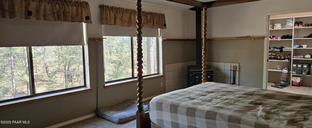 carpeted bedroom featuring baseboards