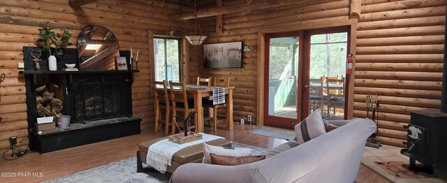 living area with a fireplace and wood finished floors