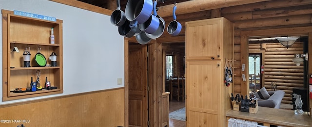 interior space with a wainscoted wall and wood finished floors