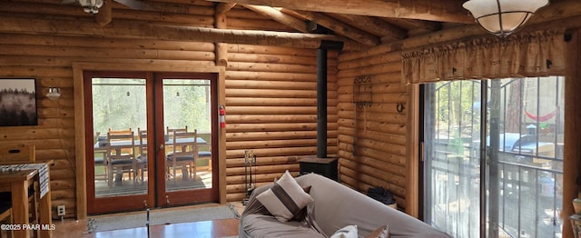 entryway featuring beamed ceiling and wood finished floors