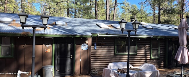 exterior space with metal roof