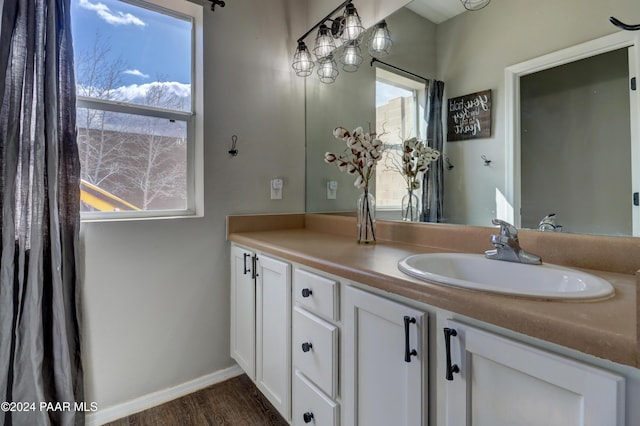 bathroom featuring vanity and hardwood / wood-style flooring