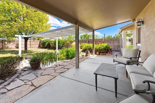 view of patio / terrace featuring a fenced backyard and a pergola