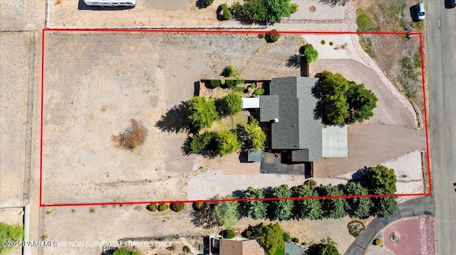 drone / aerial view with view of desert