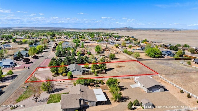 birds eye view of property with a residential view and a mountain view