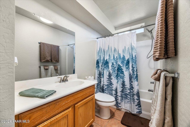 full bathroom featuring toilet, vanity, tile patterned floors, and shower / bath combo with shower curtain