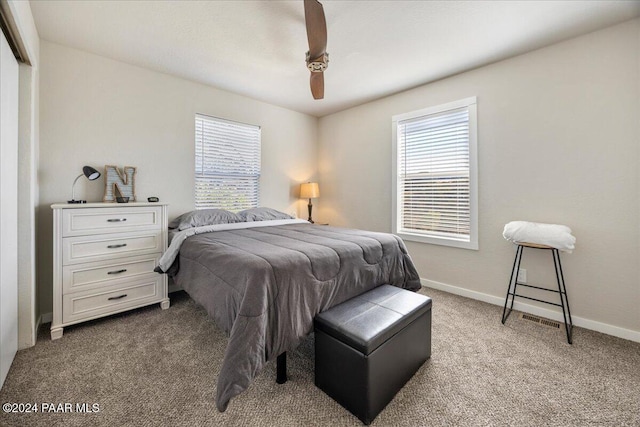 carpeted bedroom with ceiling fan