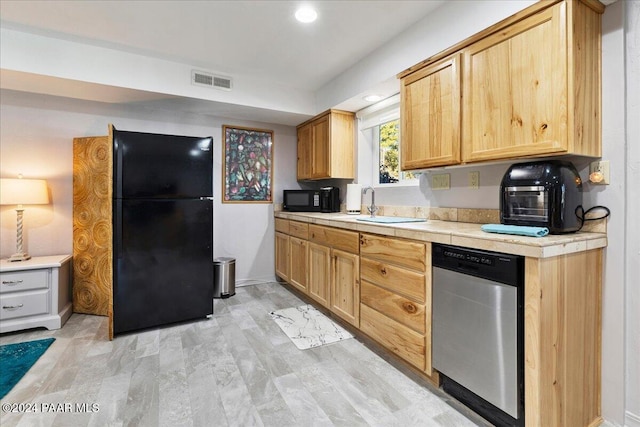 1568 W Thumb Butte Rd, Prescott, AZ 86305 - kitchen featuring black appliances, tile counters, light brown cabinetry, recessed lighting, and light wood-type flooring